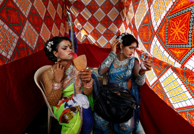 Eunuchs apply make-up before Raksha Bandhan festival celebrations in a red light area in Mumbai, India, August 17, 2016. (photo courtesy REUTERS/Danish Siddiqui)